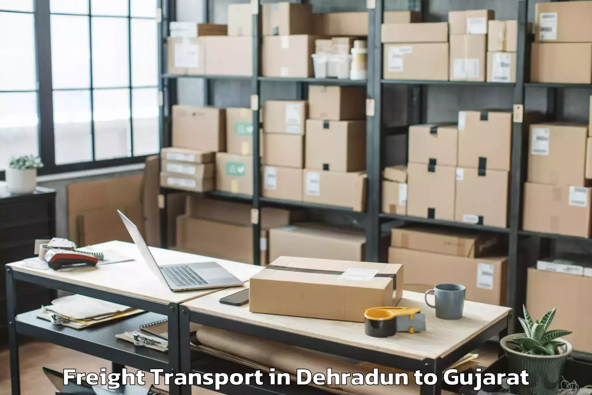 Trusted Dehradun to Harij Freight Transport